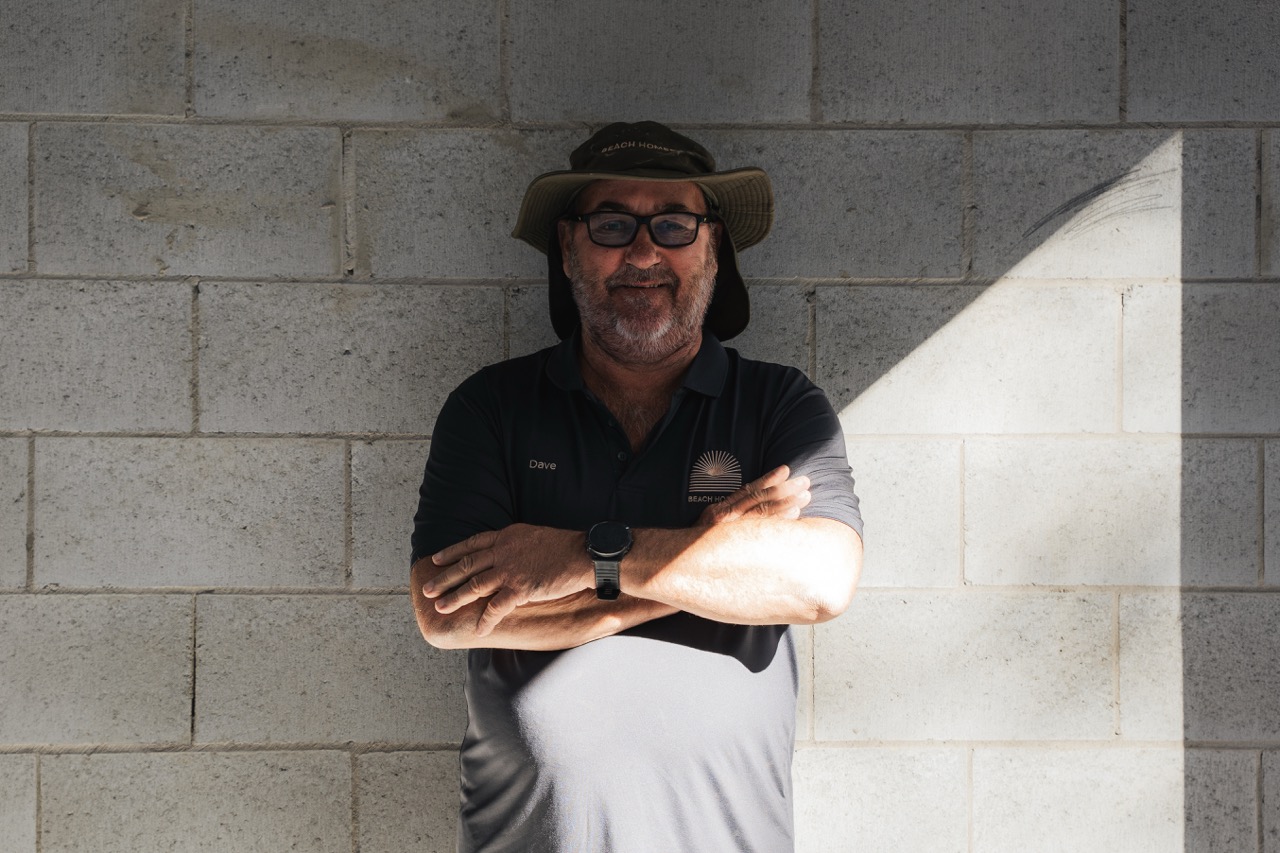 Beach Homes team member beside blockwork